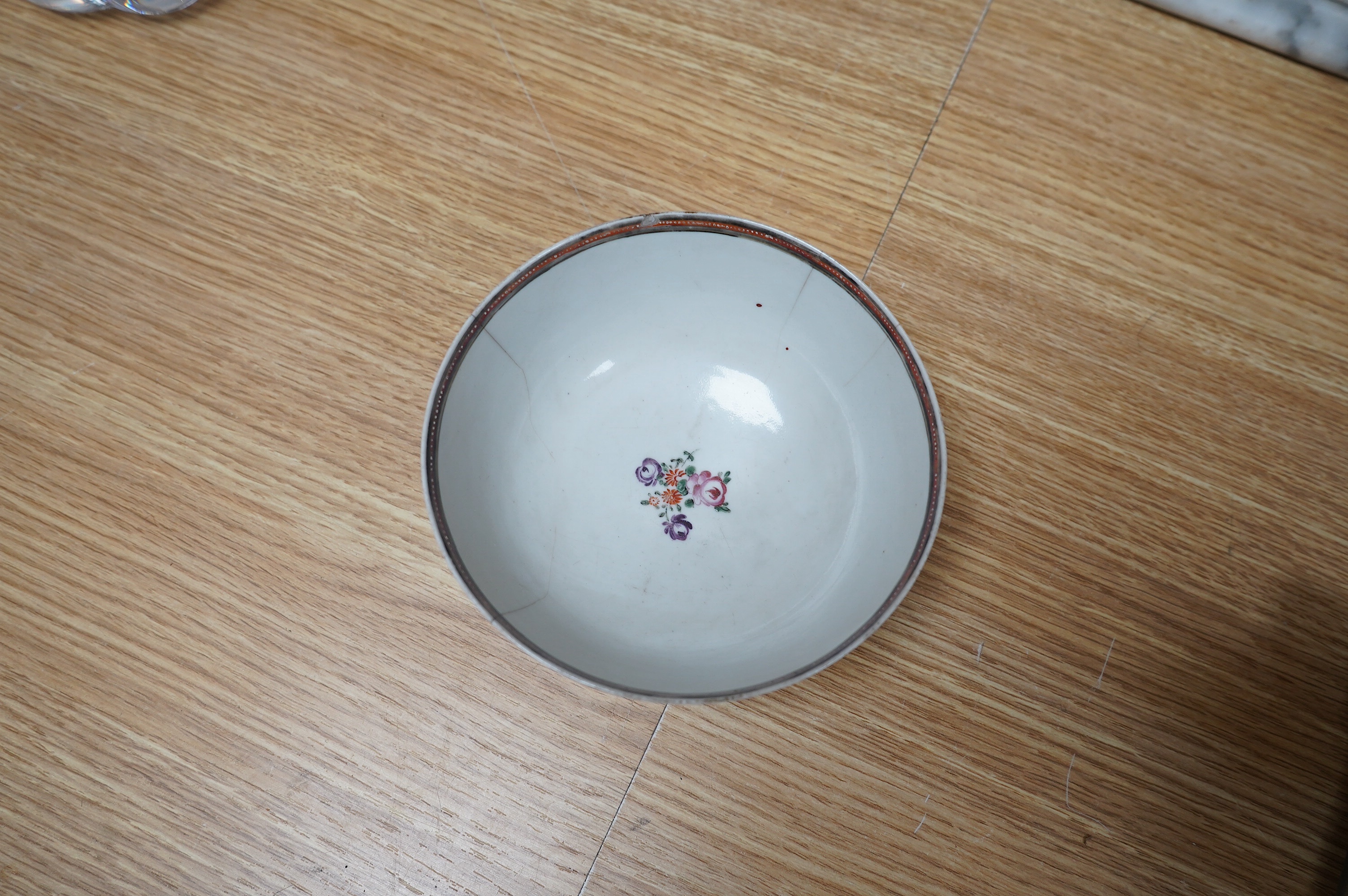 Three small 18th century Chinese export porcelain dishes, three bowls and a cup, largest 14cm. Condition - poor